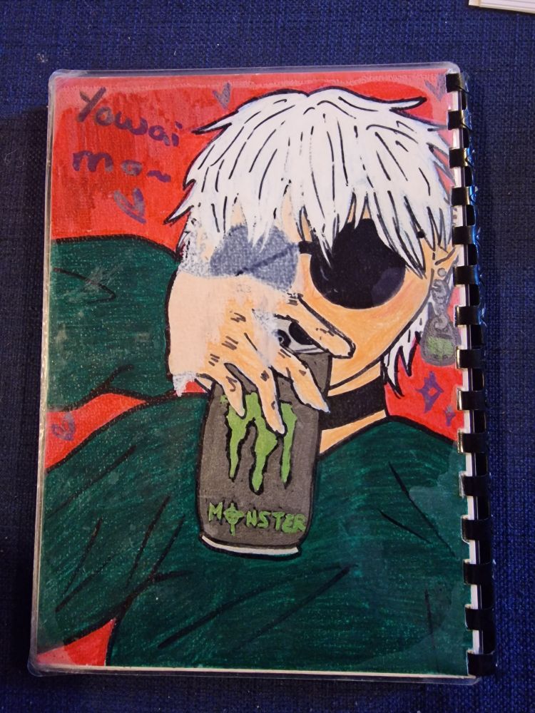 The backside of my sketchbook with casual Gojo but added a monster energy addiction 