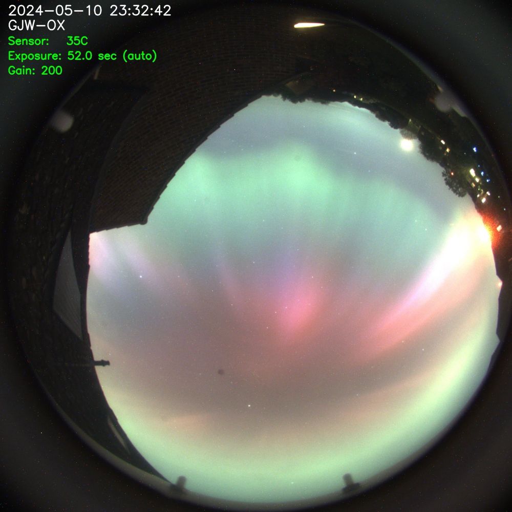 View of the sky showing rich colours of the northern lights.