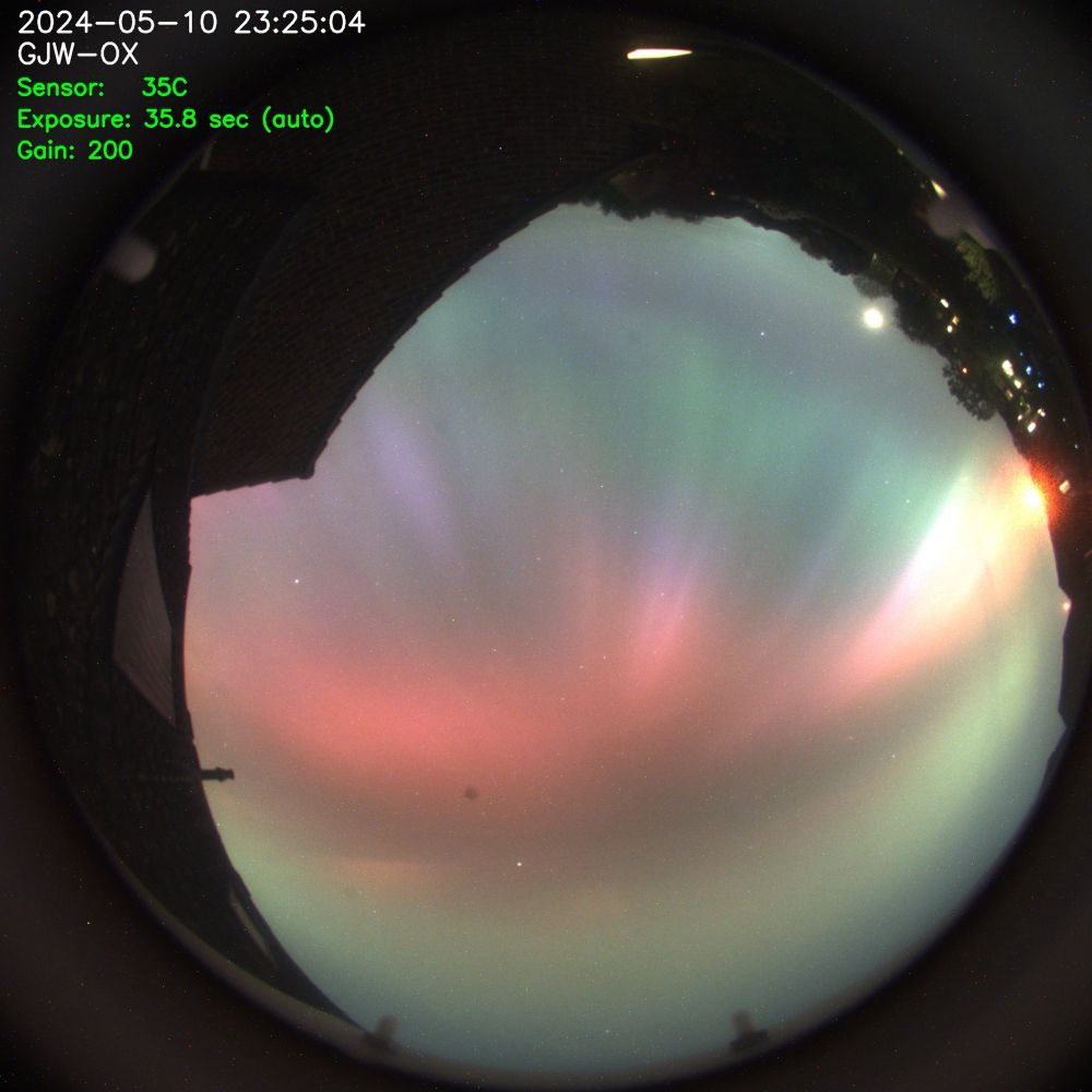 View of the sky showing rich colours of the northern lights.