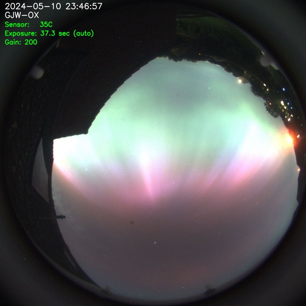 View of the sky showing rich colours of the northern lights.