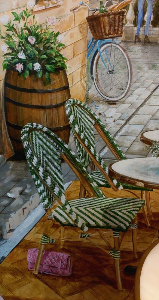 Detail from the mural in Buon Macaron Patisserie, showing a pink handbag carelessly left behind a chair. Artist is local to Stroud but waitress could not remember his name.