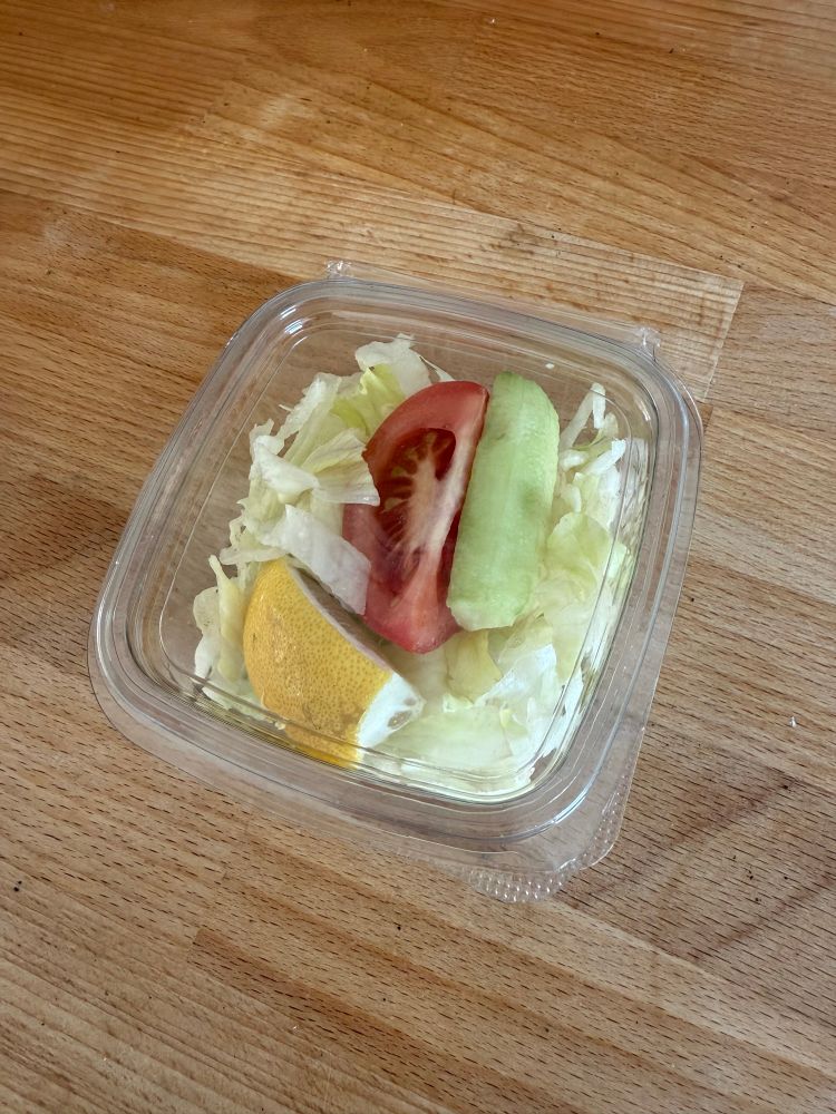 Tiny salad in a clear plastic box
