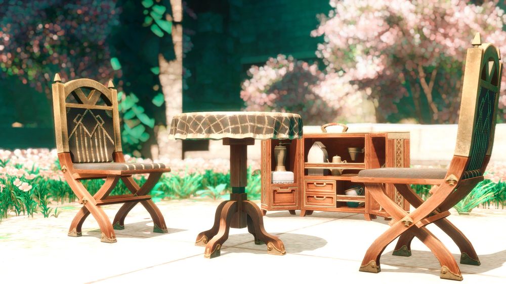 A screenshot from Final Fantasy 14. A small table and two chairs are set up in a little garden, with a small case containing tea supplies open beside it. Both chairs are empty.