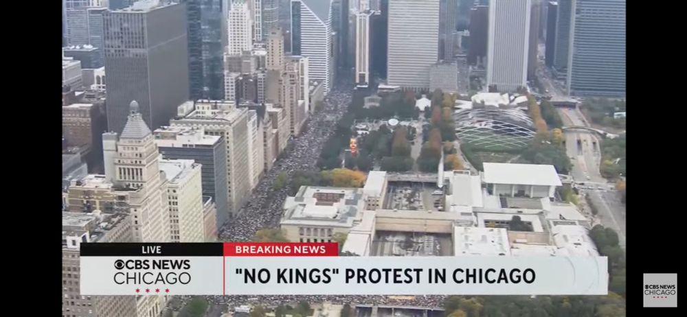 Screenshot of CBS news chicago no kings protest aerial view of millennium park and the protest crowd stretching from Columbus and Jackson up to Michigan and Wacker