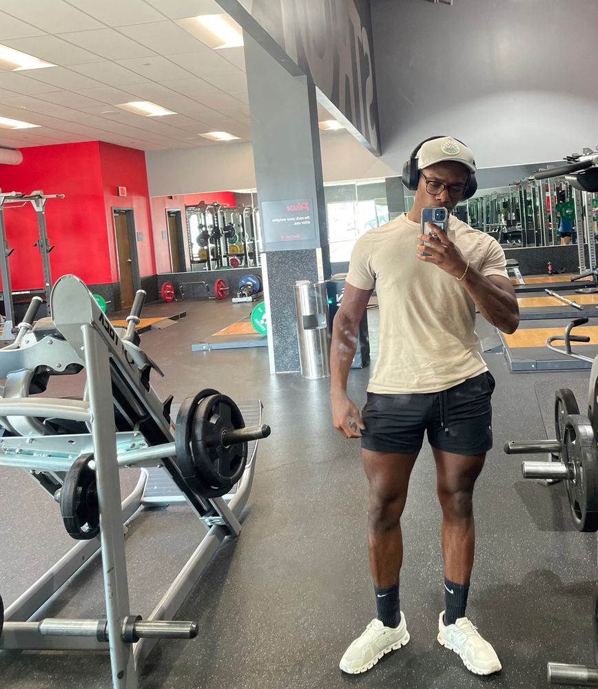 Me standing in front of the mirror at the gym