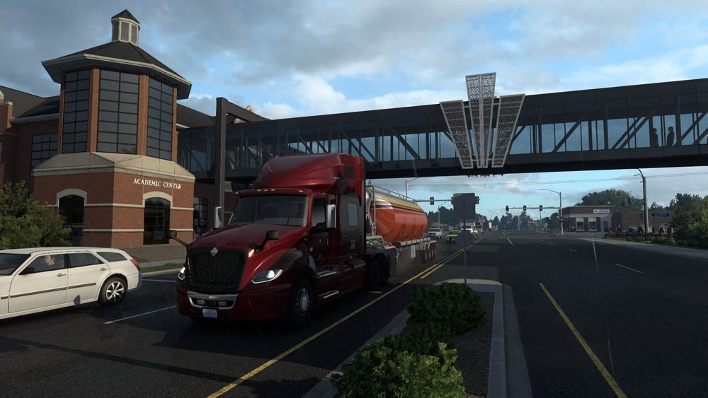 A picture from within American Truck Simulator(ATS) of my truck and trailer driving under a pedestrian bridge.