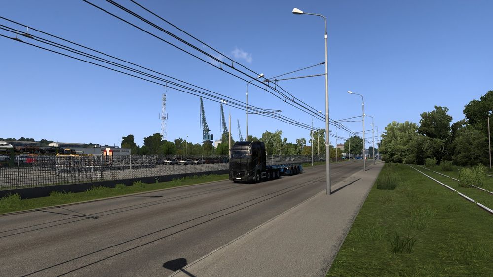 A picture from within European Truck Simulator 2(ETS2) of my truck and trailer on route to pick up some cargo.