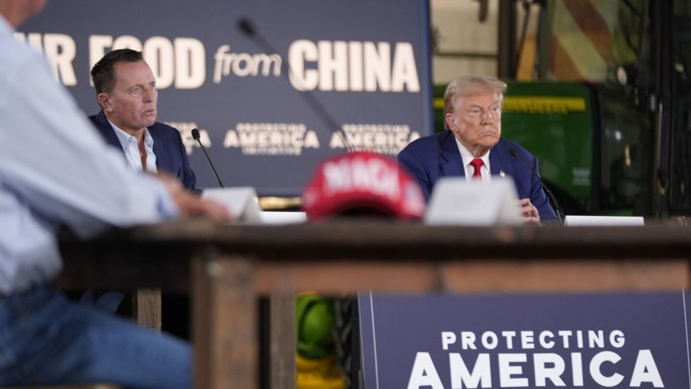 Trump listens during a farming event in rural Pennsylvania, then threatens John Deere with tariffs