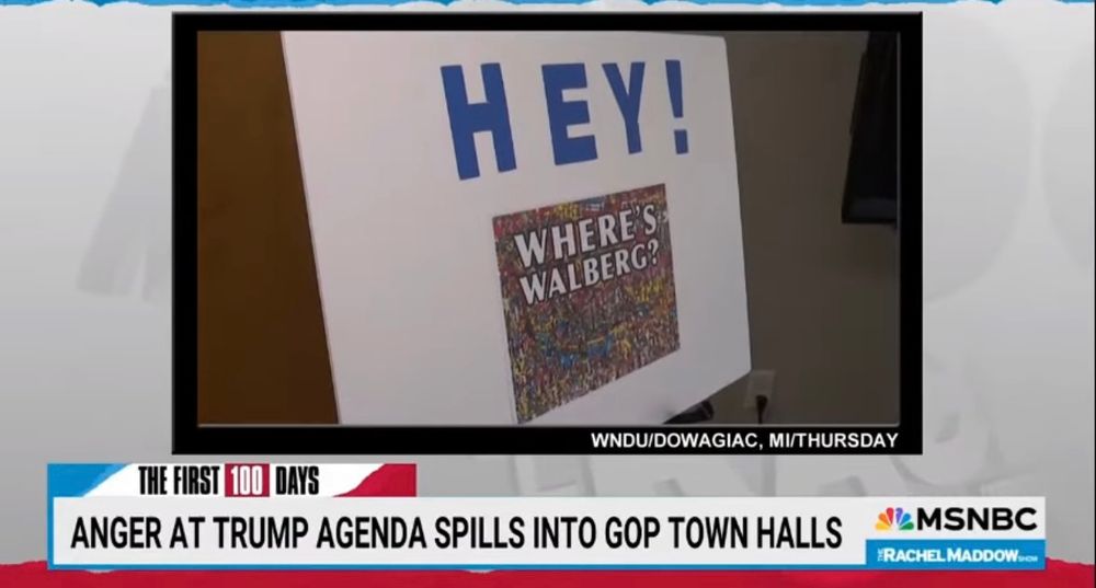 News screen with an image of a poster board saying “hey! Where’s Walberg?” On a where’s Waldo image. News headline says “anger at Trump agenda spills into GOP town halls”. 