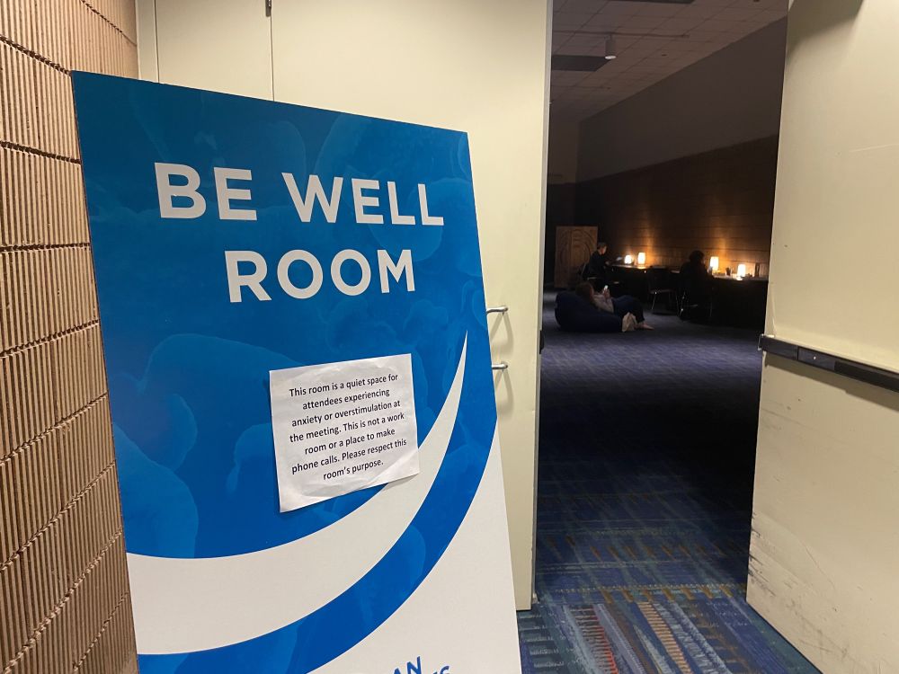 Be well room sign that says This room is a quiet space for attendees experiencing anxiety or overstimulation at the meeting. This is not a work room or a place to make phone calls. Please respect this room's purpose.