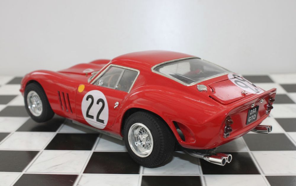 a 1/24 Plastic model of a Ferrari 250GTO, chassis number 3757GT, owned by Nick Mason.  Made from a combination of the Revell and Gunze Sangyo model kits, with aftermarket decals and seatbelts, and scratch-built engine details (ignition leads, fuel line). Left rear three-quarter view.