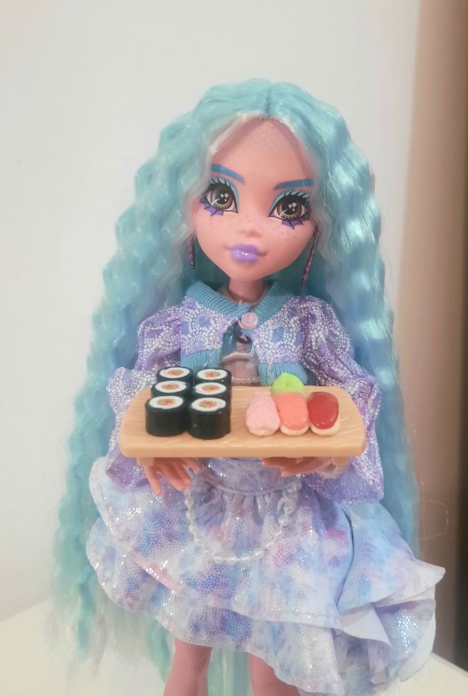 Lagoona Blue holding a sushi tray