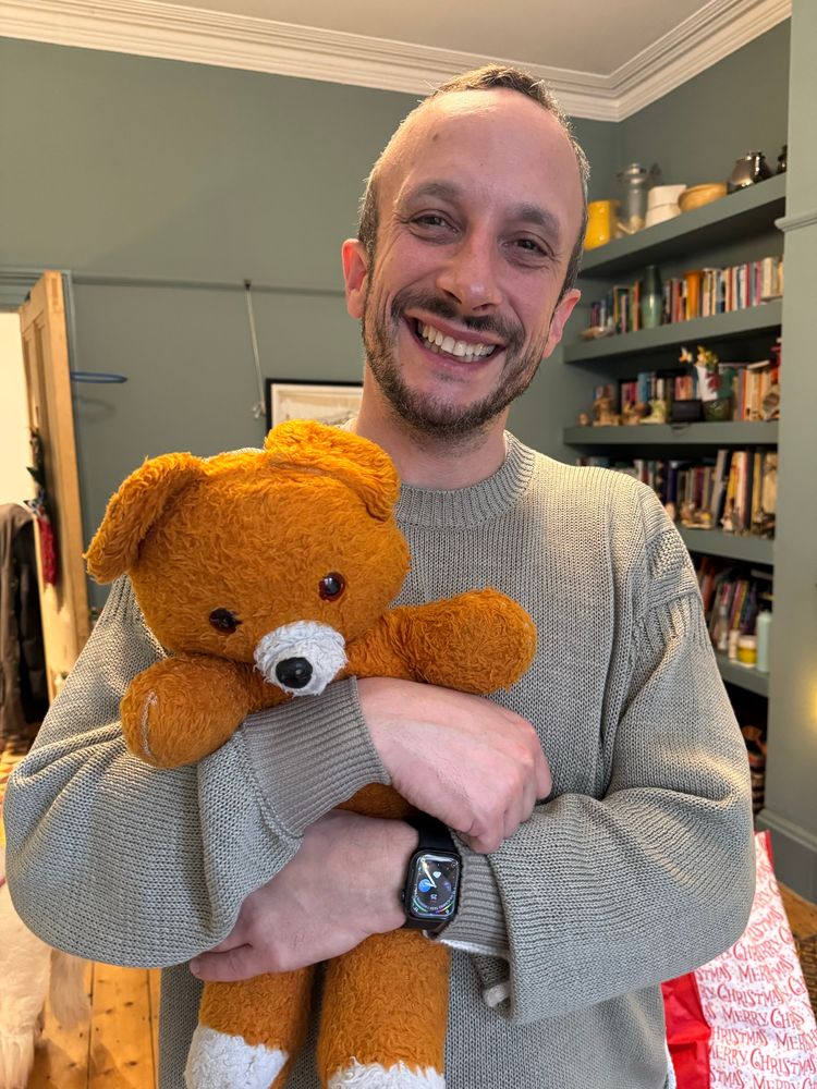 Ifan hugging a teddy bear 
