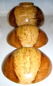 Spalted wooden bowls turned upside down to highlight grain in the wood 