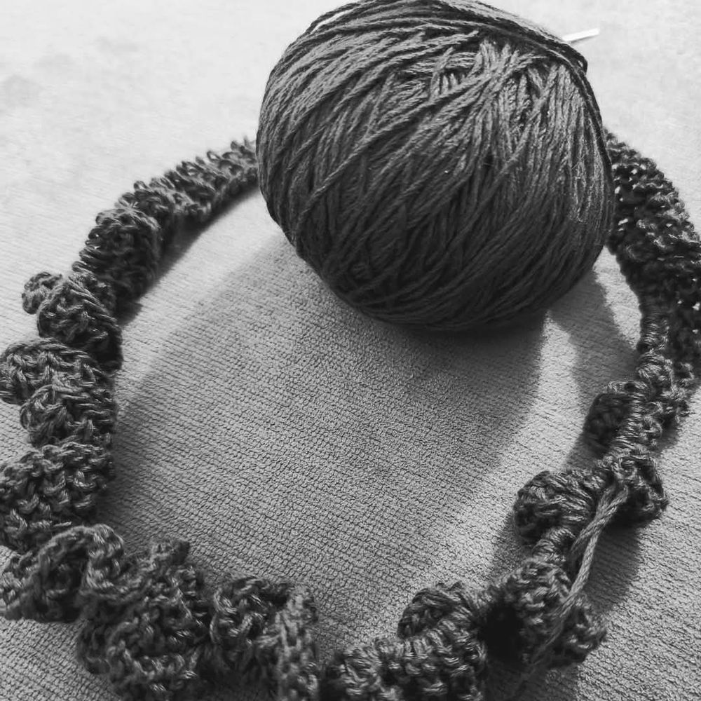 Ball of yarn with a circle of knitting