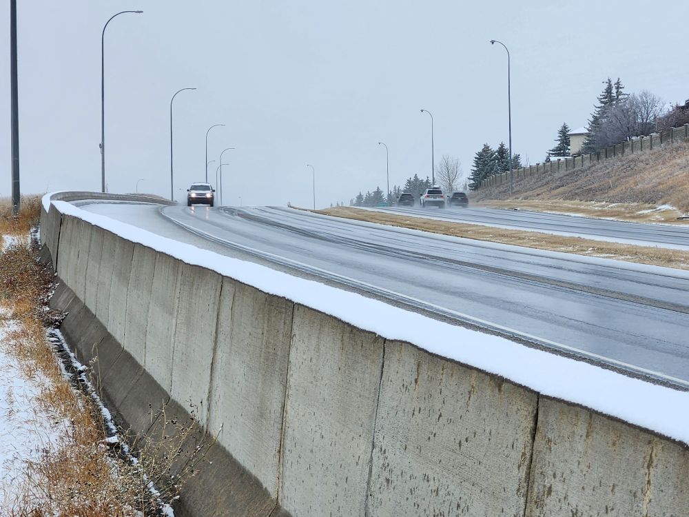 Shaganappi Trail winds down Nose Hill towards Country Hills Blvd