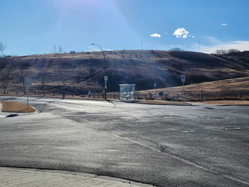 The north face of Nose Hill butting upside to MacEwan Glen Drive NW