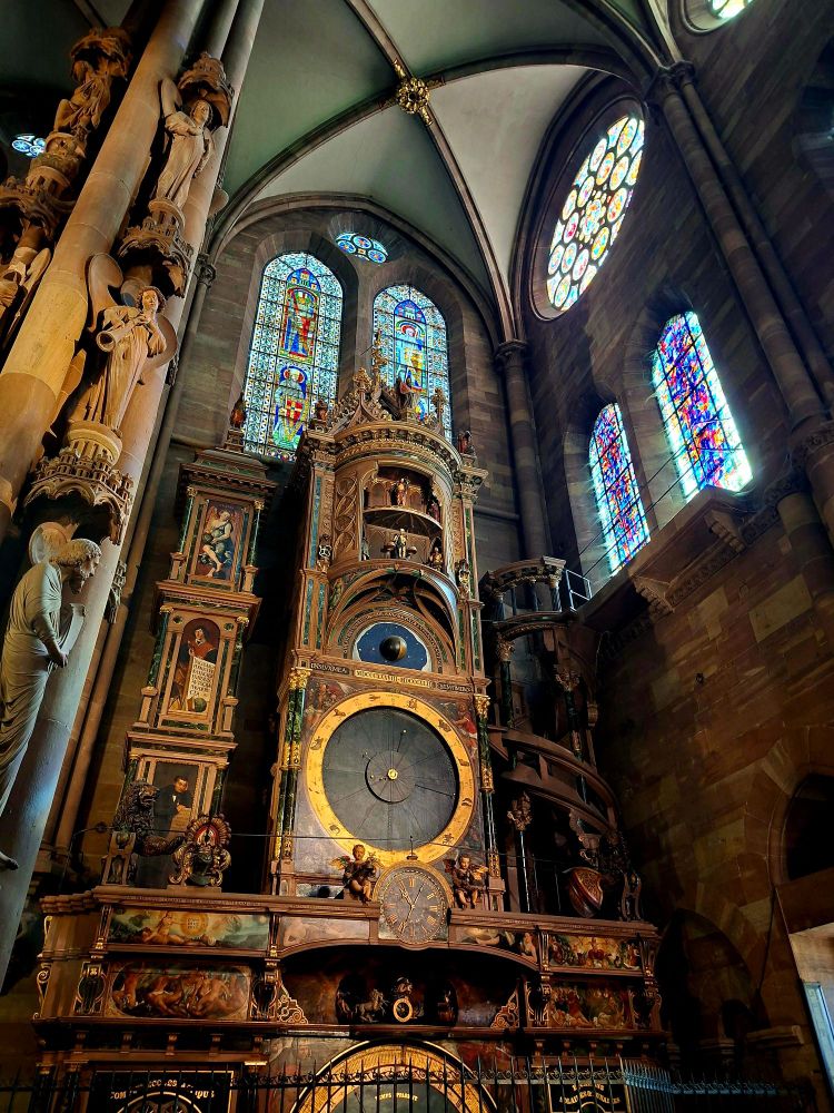 A Renaissance masterpiece, the Astronomical Clock is a result of the combined work of artists, mathematicians and technicians. Swiss clockmakers, sculptors, painters and automaton designers all worked together to produce this superb attraction. The current mechanism dates from 1842.

The main attraction of the clock is its animated figures which come out to delight the public every day at half past noon. During this performance, visitors are treated to views of the different ages of life, personified by a child, a teenager, an adult and an old man, who all parade past Death. Higher up, the apostles have their own parade, before Christ. Their journey is accompanied by the beating of wings and the sound of a large cock crowing. In front of the Clock visitors can admire the huge Pillar of Angels which offers a highly original representation of the Last Judgment.