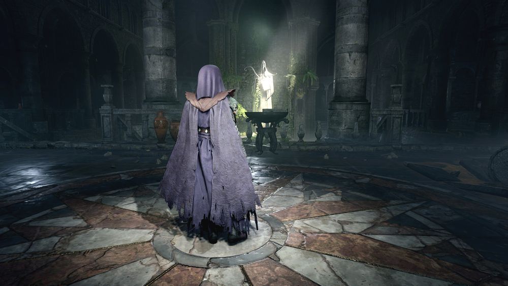 An in-game screenshot, edited slightly in GIMP, showing my durge Amarie in her postgame outfit as a cleric of Jergal. She is wearing purple robes along with brown pauldrons and a matching purple wimple. She is slightly to the left of the center of the frame with her back to the viewer. She is standing in the abandoned Jergal temple from Act 1 and is looking at an illuminated statue of Jergal, which is close to the center of the frame. 