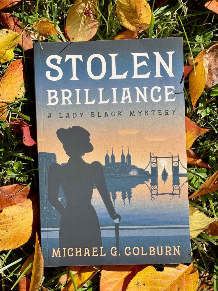 Stolen Brilliance
(A Lady Black Mystery)
Michael G. Colburn
I.P. Publishing
Publication date : August 30, 2024
344 pages, Paperback

From the slums of Victorian London to glittering diamond heists across the globe, Edith “Edie” Black is a heroine you won’t forget. Rescued from poverty yet haunted by her past, Edie walks the fine line between society’s expectations and her secret life as a daring thief. When loyalty, love and betrayal collide, she must outwit criminals, navigate high society and stay one step ahead, or risk losing everything.

Michael G. Colburn’s historical adventure wraps crime, romance and suspense into a thrilling ride. With vivid settings, clever twists and a heroine who steals both jewels and hearts, Stolen Brilliance is a must-read for lovers of historical mysteries with audacious female leads.