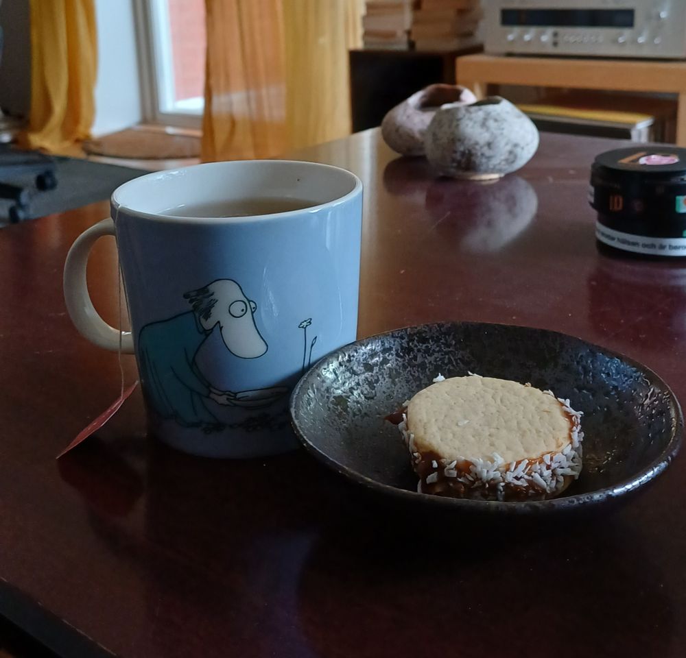 Tea in Moomin cup and an alfajor