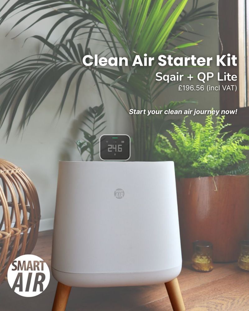 A white Smart Air “Sqair” air purifier on wooden legs placed in a cosy indoor space with plants behind it. A small QP Lite air quality monitor sits on top of the purifier displaying a reading. Text on the image promotes a “Clean Air Starter Kit” including the Sqair and QP Lite for £196.56 (including VAT).
