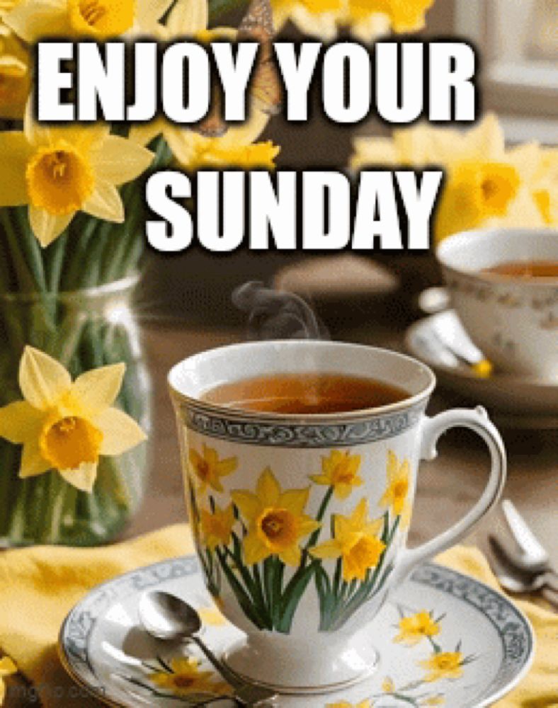 a cup of tea on a saucer with the words enjoy your sunday