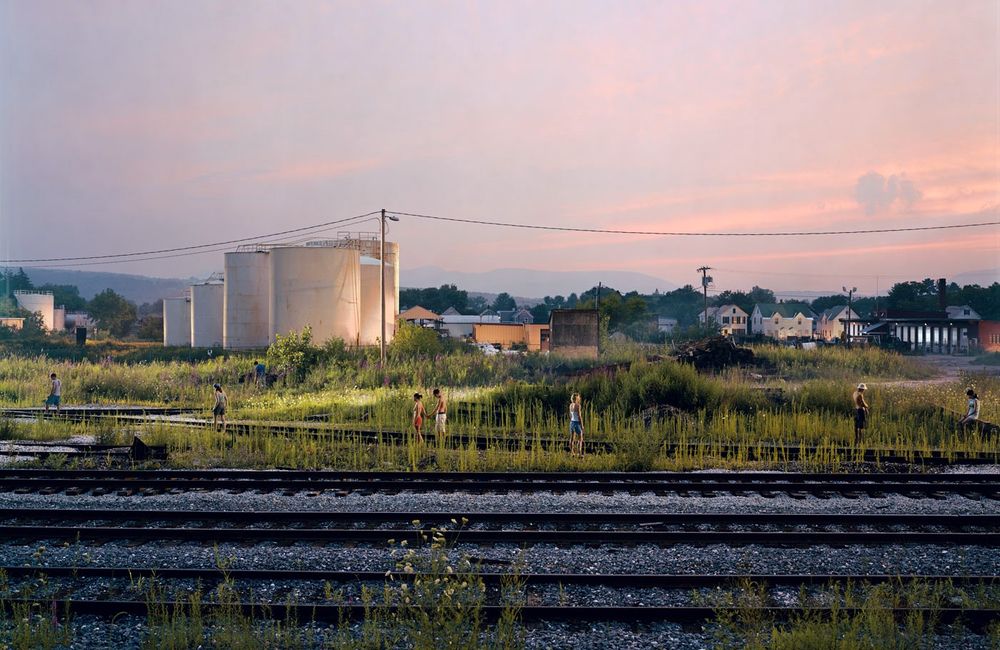 photography of kids walking along tracks in the suburbs by Gregory Crewdson