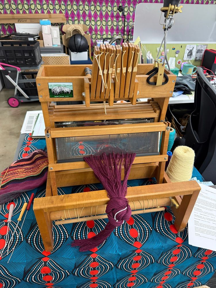A wooden loom considered one of the first computers because the woven fabric can be interpreted as binary numbers