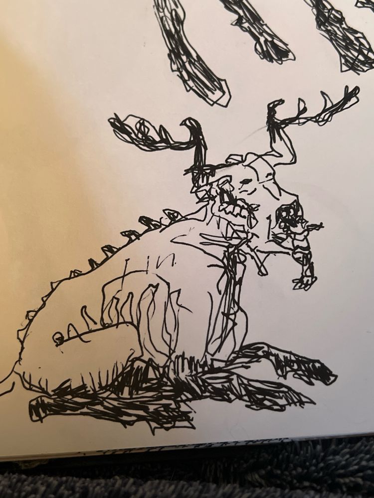 the creature laying down with its legs folded beneath it. the drawing is squiggly.