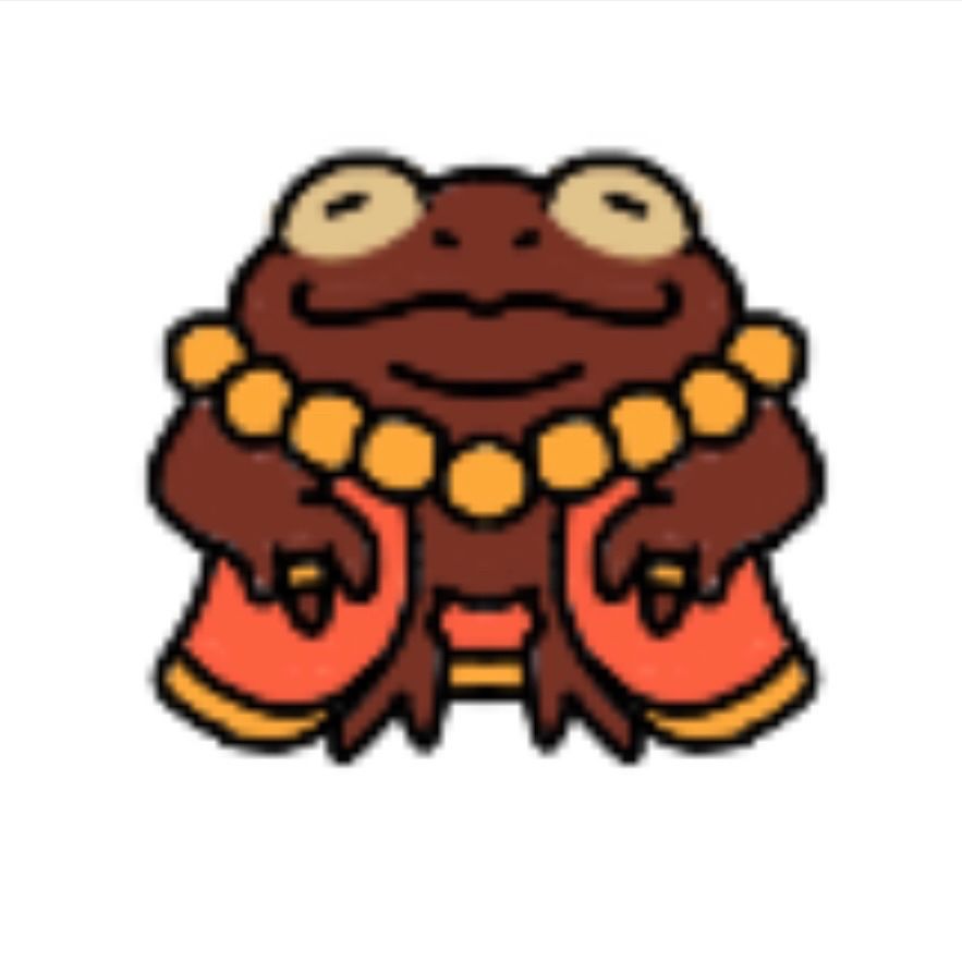 round brown toad wearing an orange robe, a yellow beaded necklace and two rings on each middle finger