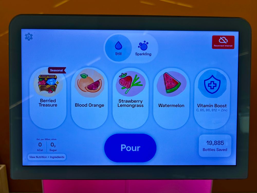 Water dispenser screen with options featuring one called “Berried Treasure” that has a treasure chest with diamonds and fruit.