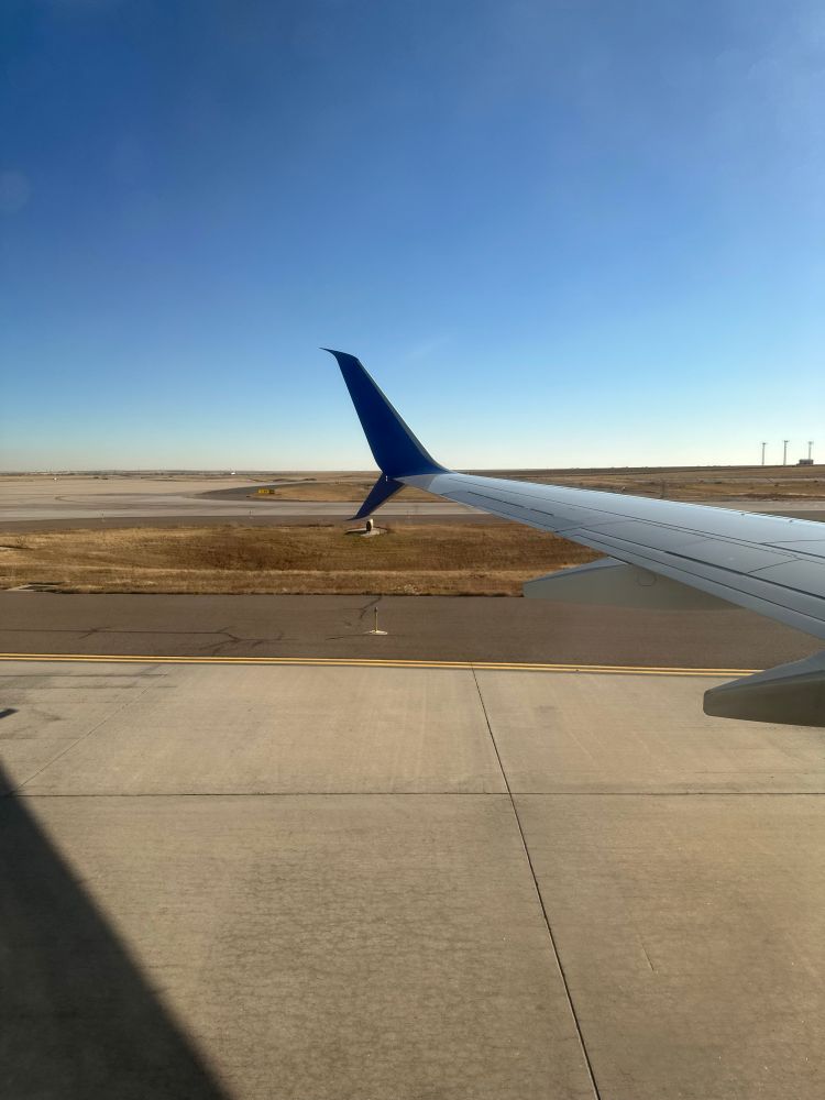 Wing tip from plane window. 