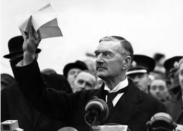 Neville Chamberlain proclaiming "Peace in Our Time," 1938.