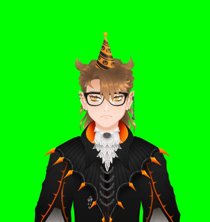 A screenshot of the Vtuber Iudex, sitting in front of his green screen. Iudex is sitting, looking grumpy while he is wearing a festive birthday hat.
