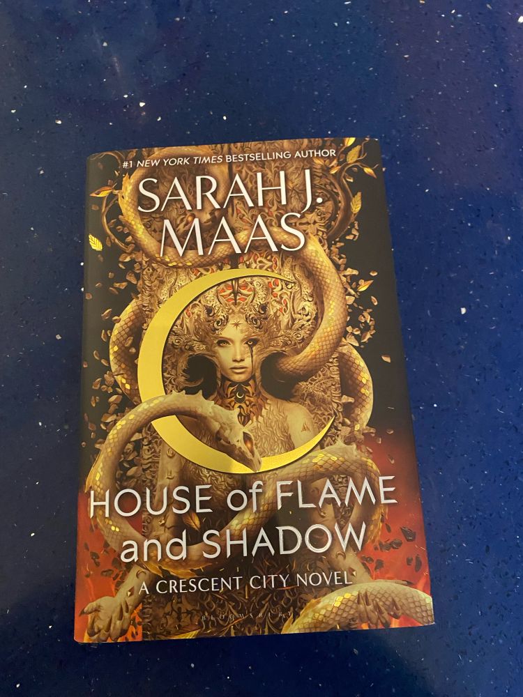 A picture of the hardback edition of House of Flame and Shadow by Sarah J. Maas, which was released Wednesday.  I have become one of those people.  It will be finished by the end of the weekend.