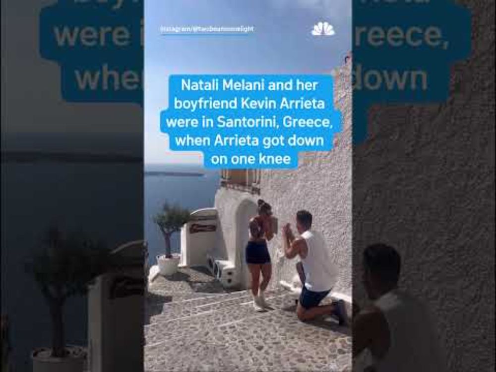 Proposal in Greece photobombed by snack-eating tourists