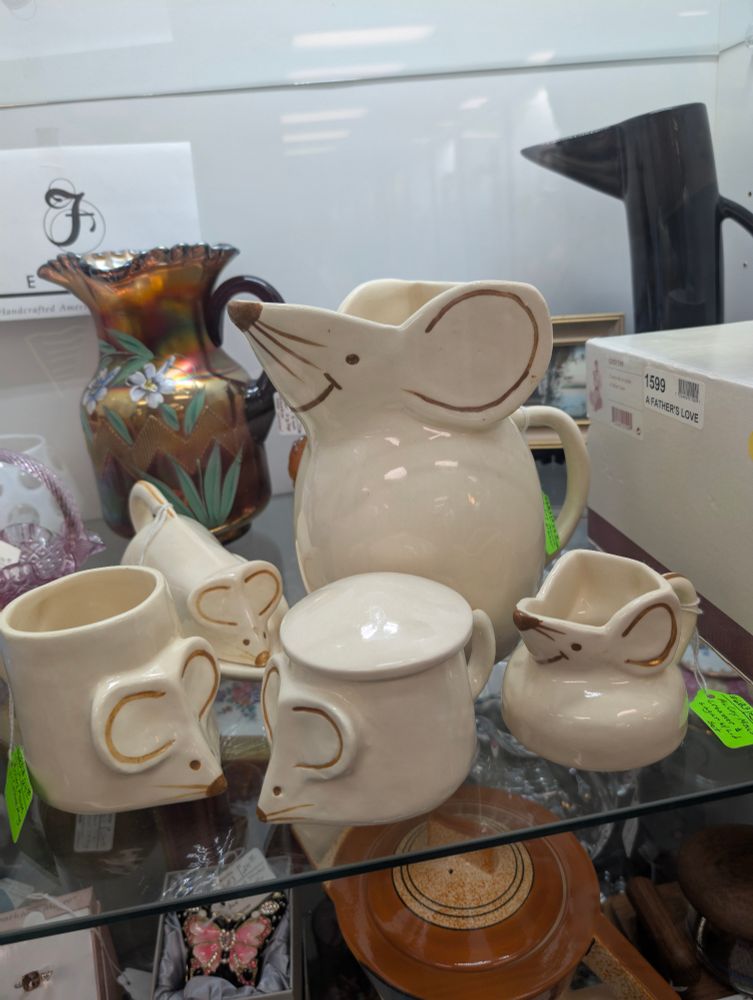 Cups, a pitcher, and a butter tray that look like mice 