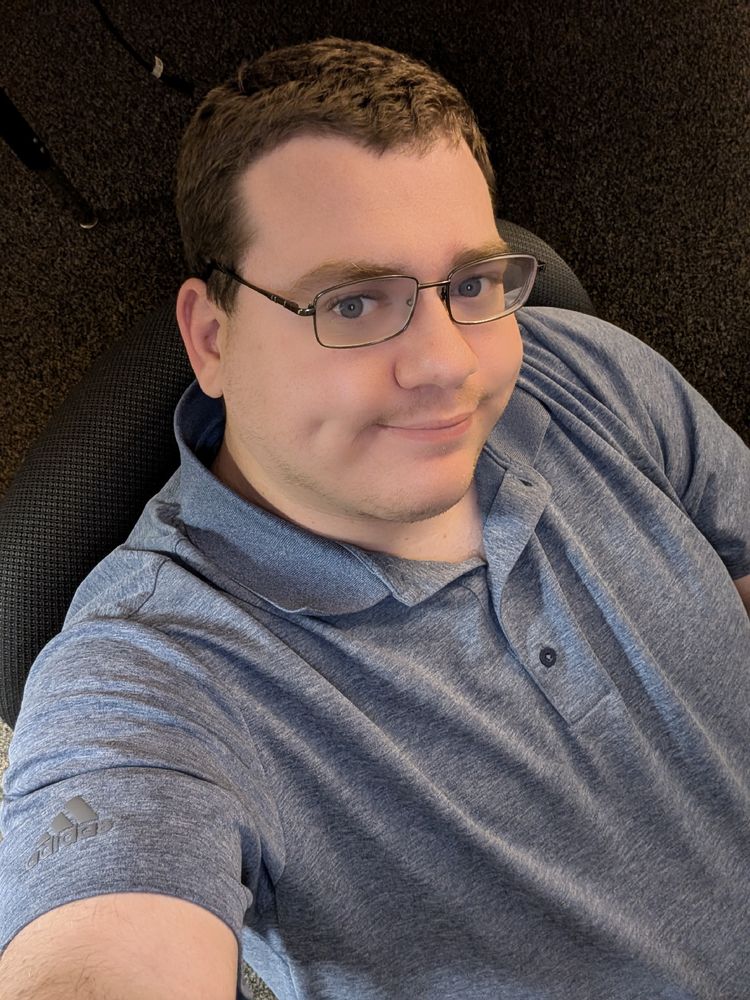 A selfie of me in a blue polo 