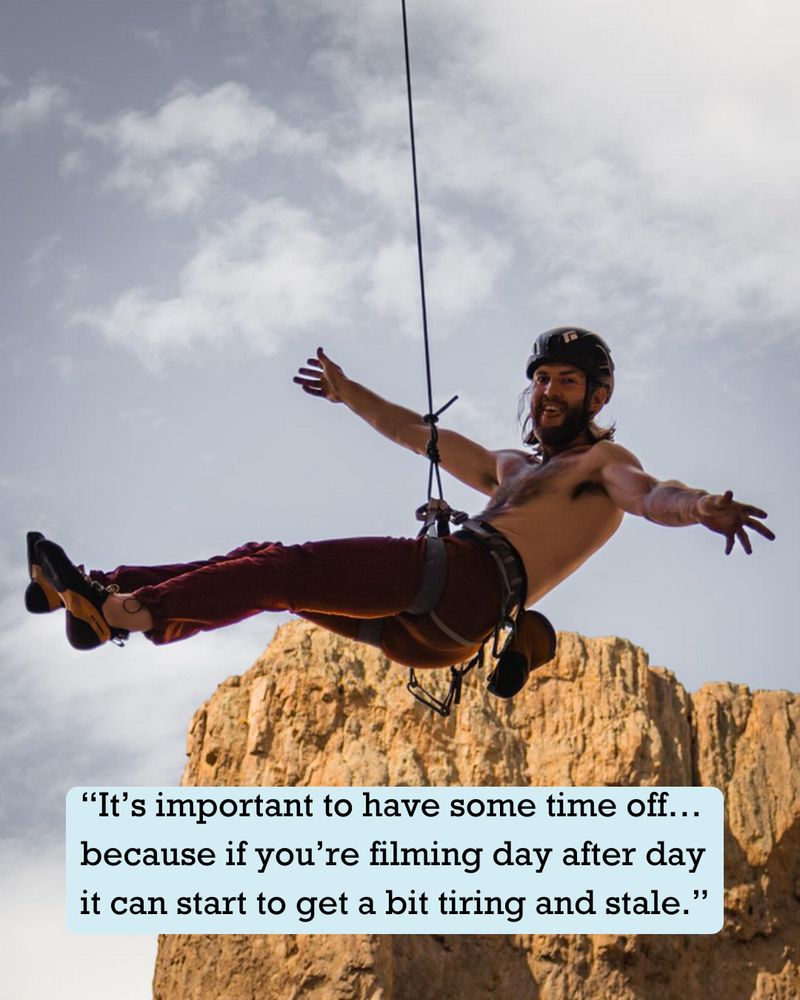 Logan Olausen hanging from a climbing rope.
Onscreen text: "'It's important to have some time off... because if you're filming day after day it can start to get a bit tiring and stale.'"