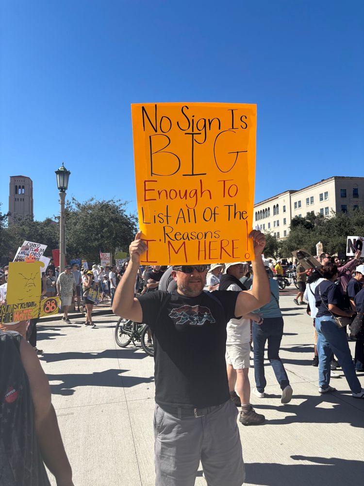 No sign is big enough to list all the reasons I’m here. No Kings mPasadena protester holding sign.