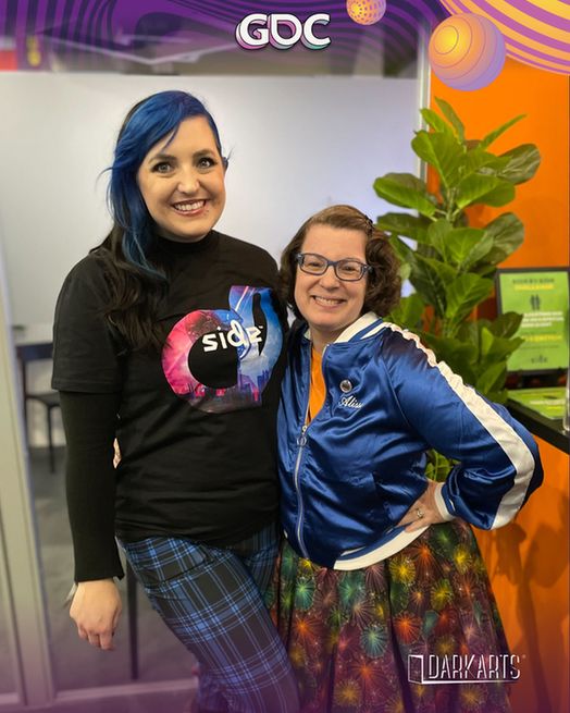 Christina-Marie Drake and Alissa Brodsky in a Dark Arts Blue Track Suit  at GDC