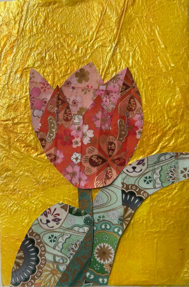 A red tulip with green leaves in patterned washi tape on a yellow  background. 