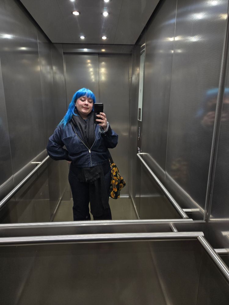 Mairi in an elevator