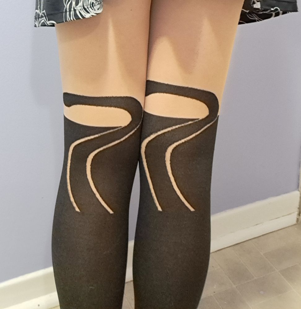 Back of the cat leggings with the kitty tails.