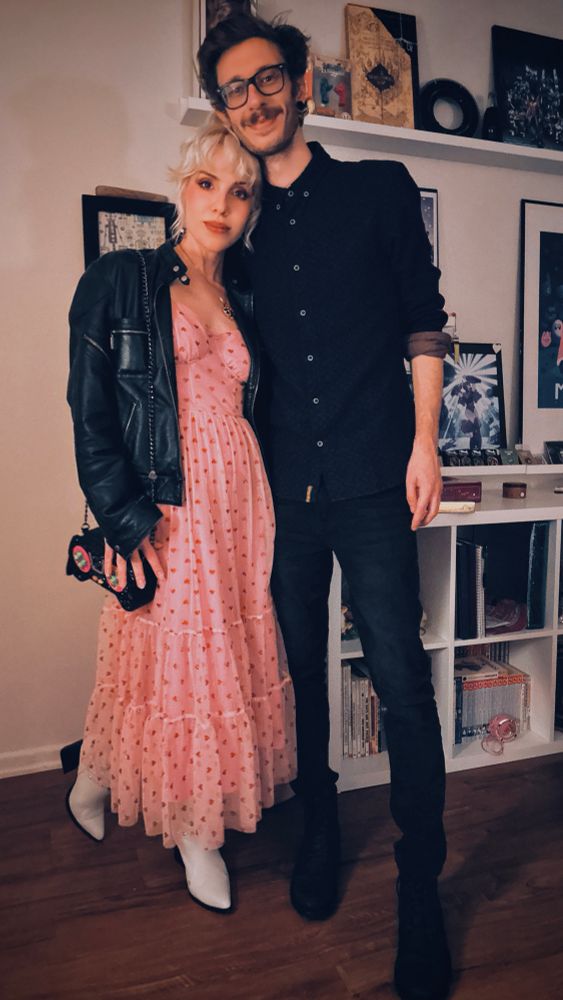 A woman (me) and the man I tricked into dating me are dressed up to go out