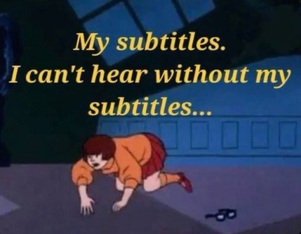 A picture of Velma looking for her glasses with the words, “my subtitles. I can’t hear without my subtitles.”