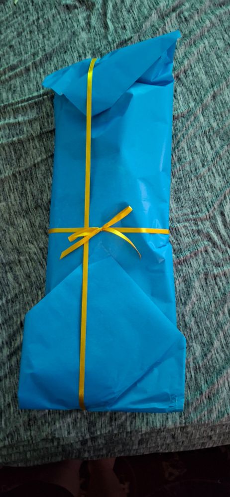 LienesToys doll wrap in pretty blue paper and a yellow ribbon