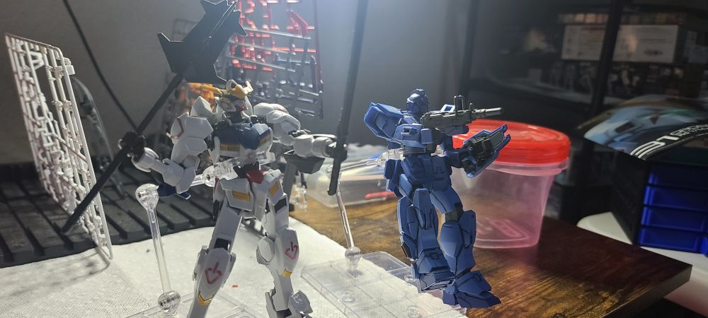 Barbatos and Blue Destiny 01 posing on bases
