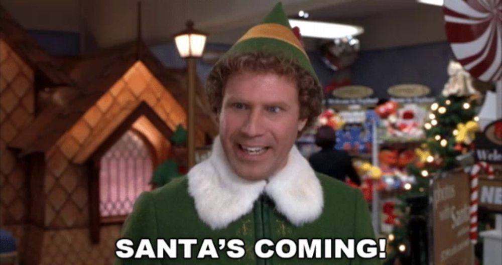 an elf says santa 's coming in a christmas scene